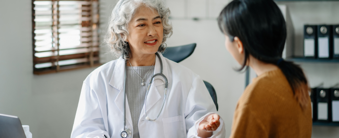 female doctor talking to patient