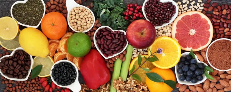 Variety of colourful fruits, vegetables, legumes, nuts, and seeds rich in flavonoids and antioxidants, supporting heart health and reducing inflammation.