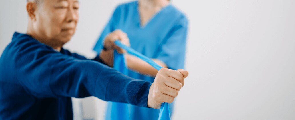 man stretching resistance band