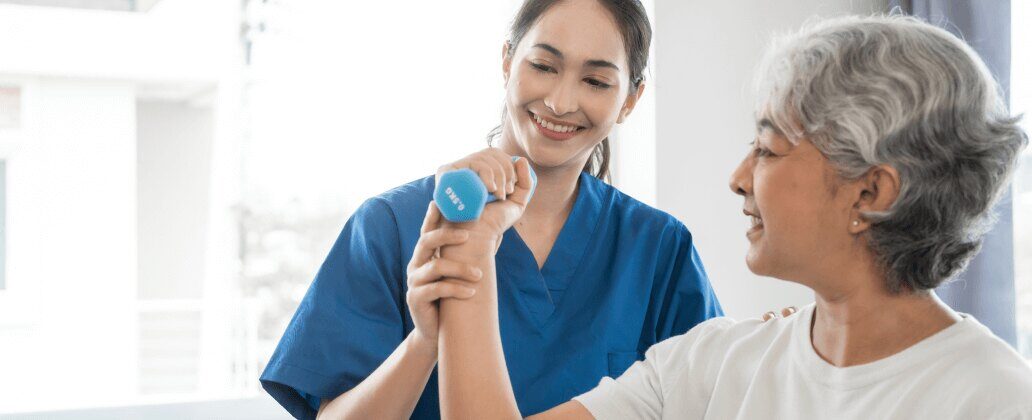 woman lifting weights supported by doctor