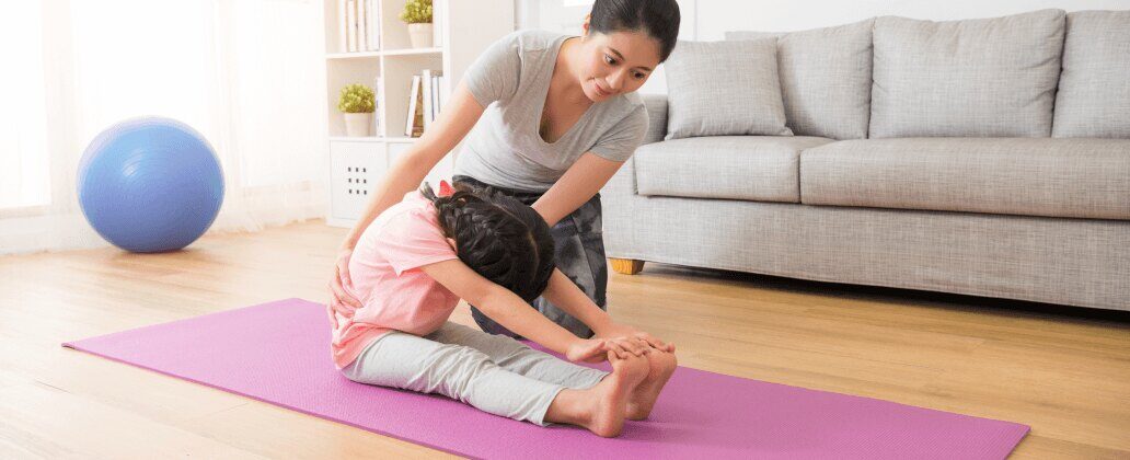 mum helping child stretch