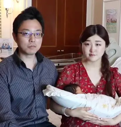 mr and mrs wakuta, with their new born baby